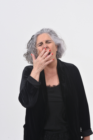 woman yawning on white backgroundの写真素材