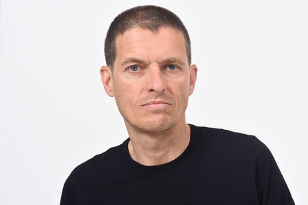 portrai of a middle aged man on whiteの写真素材