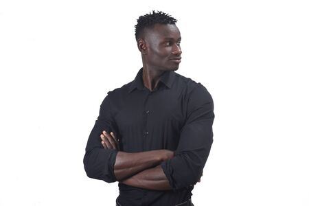 portrait of an african man with arms crossed and looking to the side,の写真素材