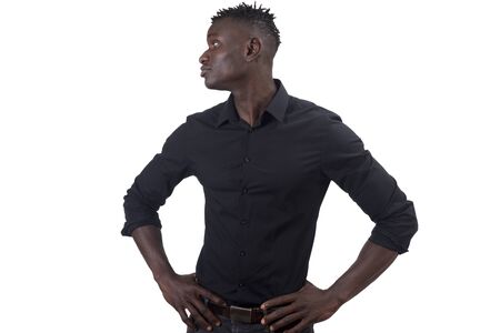African man with arms on waist looking to the side, seriousの写真素材