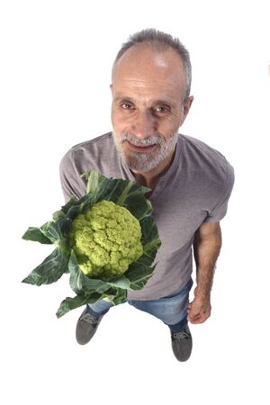 portrait of a man with broccoli on white backgroundの写真素材