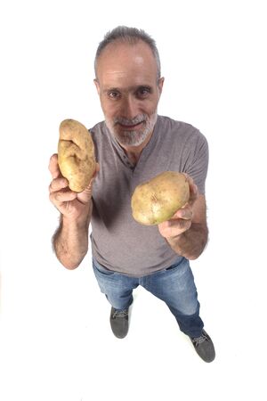 portrait of a man with pototoes on white backgroundの写真素材