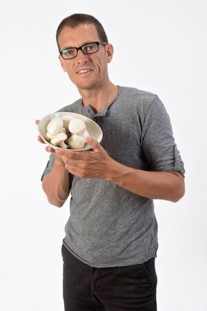 man with mushroom on white backgroundの写真素材