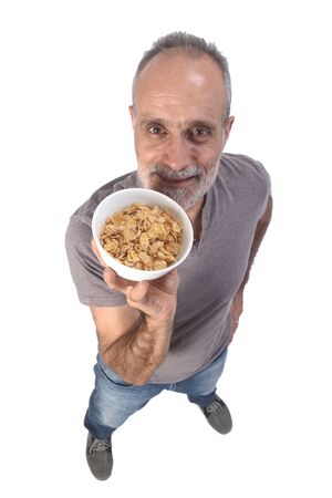 man with corn  flakes bar on white backgroundの写真素材