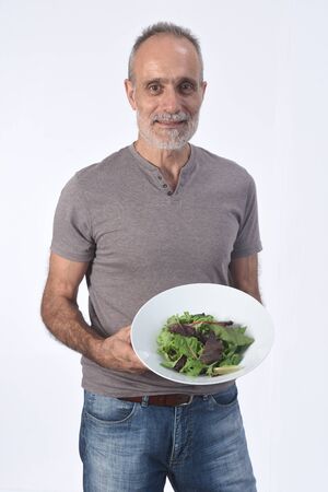 man with salad on white backgroundの写真素材