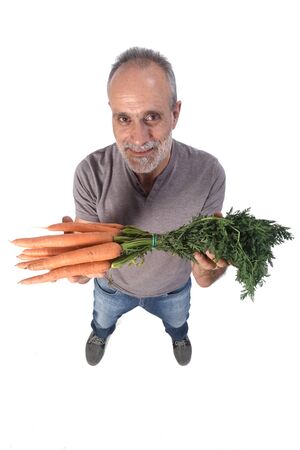 portrait of a man with carrot on white backgroundの写真素材