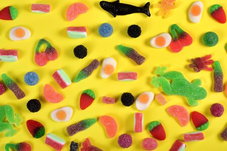 top view of jelly candies collection on yellow backgroundの写真素材