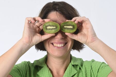 woman with kiwi on white backgroundの写真素材