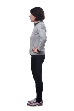 side view of a woman in white background, hands on hipの写真素材