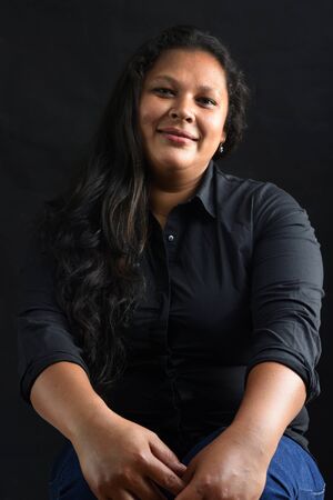 Portrait of a latin woman on blackの写真素材