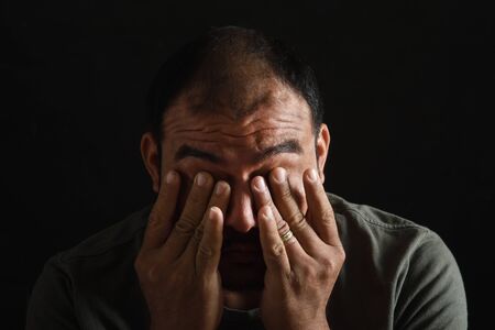 latin american man tired and fatiguedの写真素材