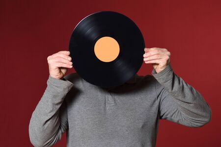 music record cover his face on red background