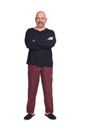 man in pajamas on white background, arms crossedの写真素材