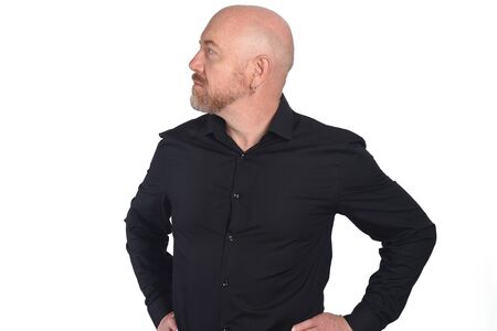 portrait of a man side with shirt  and hands on waist on white backgroundの写真素材