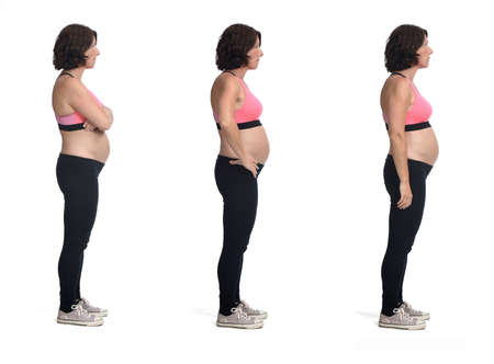 same pregnant woman with sportswear isolated on white background,side viewの写真素材