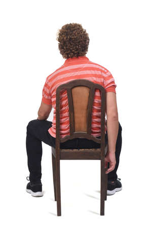 rear view of full a portrait of a curly man sitting on white background,の写真素材