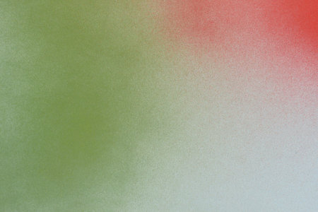 red and green spray paint on blue backgroundの写真素材