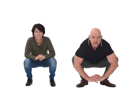 a couple squatting over white backgroundの写真素材