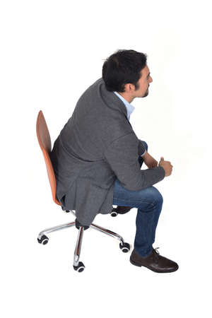 high angle view of a man sitting, side view, on white backgroundの写真素材