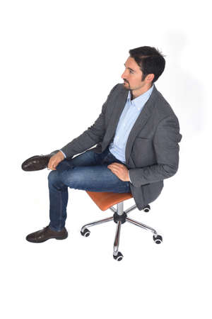 high angle view of a man sitting legs crossed on white backgroundの写真素材
