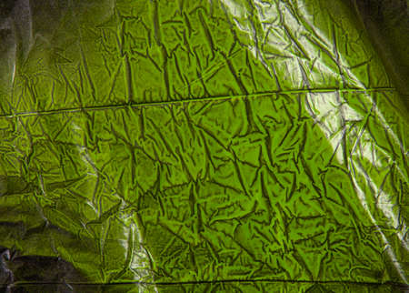 black plastic painted with colored spray paint greenの写真素材