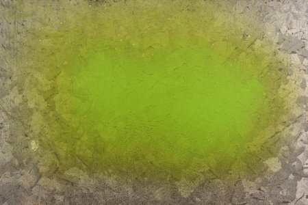 green spray paint on galvanized sheet metalの写真素材