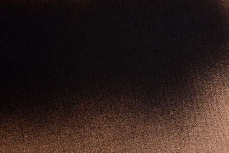 colored spray black paint on cardboard