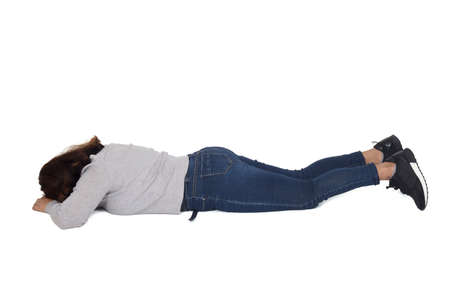 front view of woman sitting on the floor, looking at camera and with the hand on the knee on white...