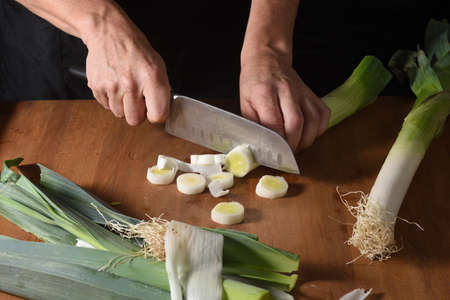 high angle view of a leek cut on woodの写真素材