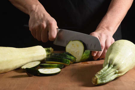 front view of the cut of a zucchini on a woodの写真素材