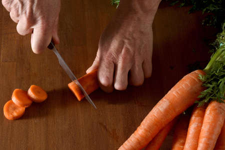 close up of high angle view of the cut of a carrots on a woodの写真素材