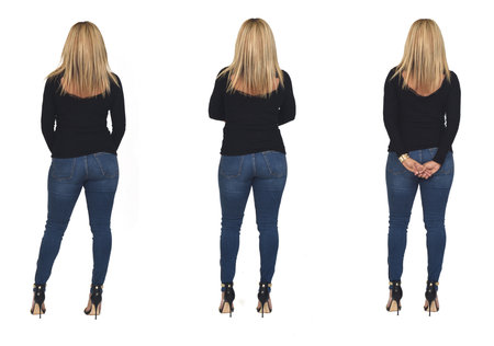 rear view of a woman with jeans on white backgroundの写真素材
