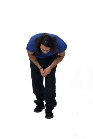 man searching on the floor on white backgroundの写真素材