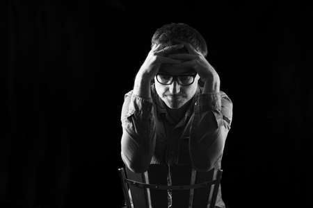 portrait of a man thimking on blackの写真素材