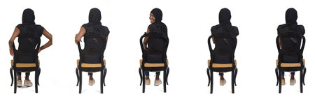 back view of group of same woman sitting on chair on white backgroundの写真素材