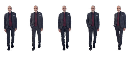 front view of group of same man with suit and tie walking on white backgroundの写真素材