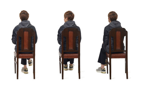 back view same woman clothing in sportswear and onorak sitting on chair, on white backgroundの写真素材