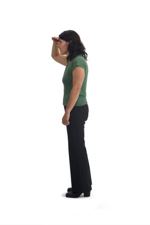 side view of a woman with her hand on her forehead looking into the distance on white backgroundの写真素材
