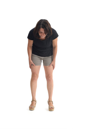 front view of a woman crouching and looking at the ground on white backgroundの写真素材