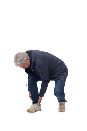 full length portrait of a man in achilles tendon pain isolated on whiteの写真素材