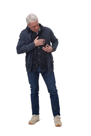 full length portrait of a man in chest pain in isolated on whiteの写真素材