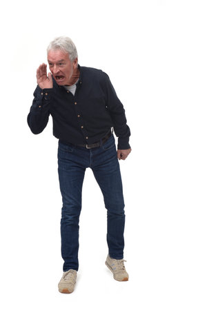screaming man with open mouth and raised arms looking to the side on white backgroundの写真素材
