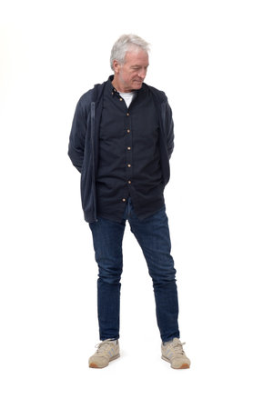 full length front view portrait of a man looking down at the ground on white backgroundの写真素材