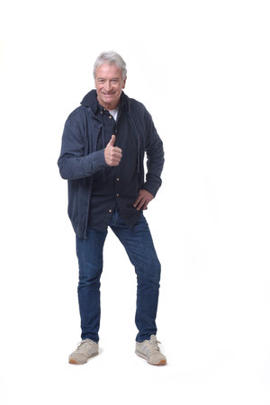 front view of a full length portrait of a man thumbs up on white backgroundの写真素材
