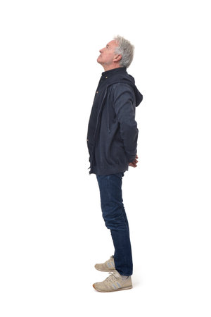 full portrait of side view of a man looking up on white backgroundの写真素材