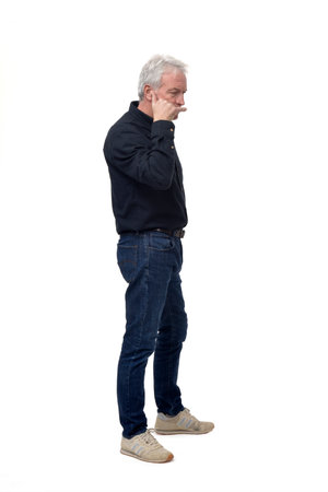 man making phone gesture with his hands serious white backgroundの写真素材