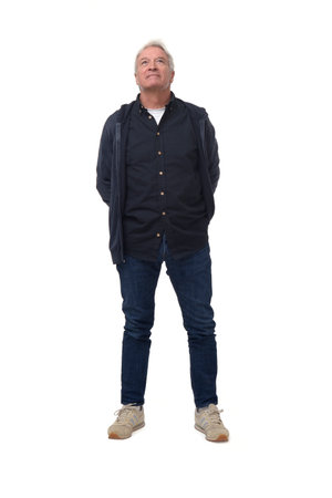 front view of a full length portrait of a man looking up on white backgroundの写真素材