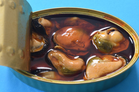 close up of a can of mussel on blue backgroundの写真素材