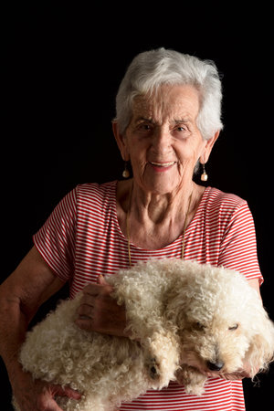front view of a full portrait of a senior woman hands on back on white background
