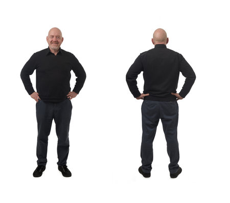 front and back of same man standing and arms akimbo on white backgroundの写真素材